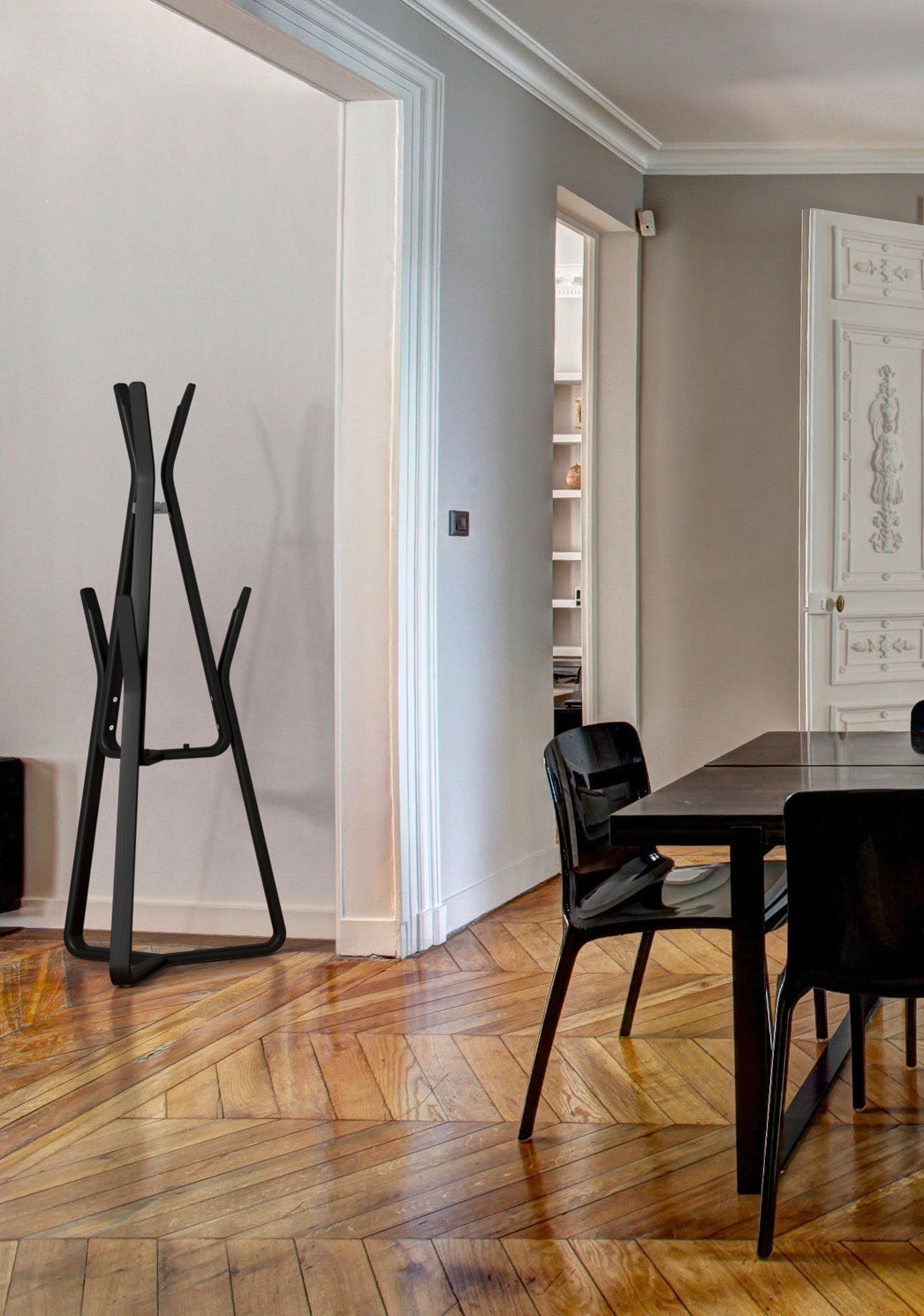 Black stained wooden coat rack in home