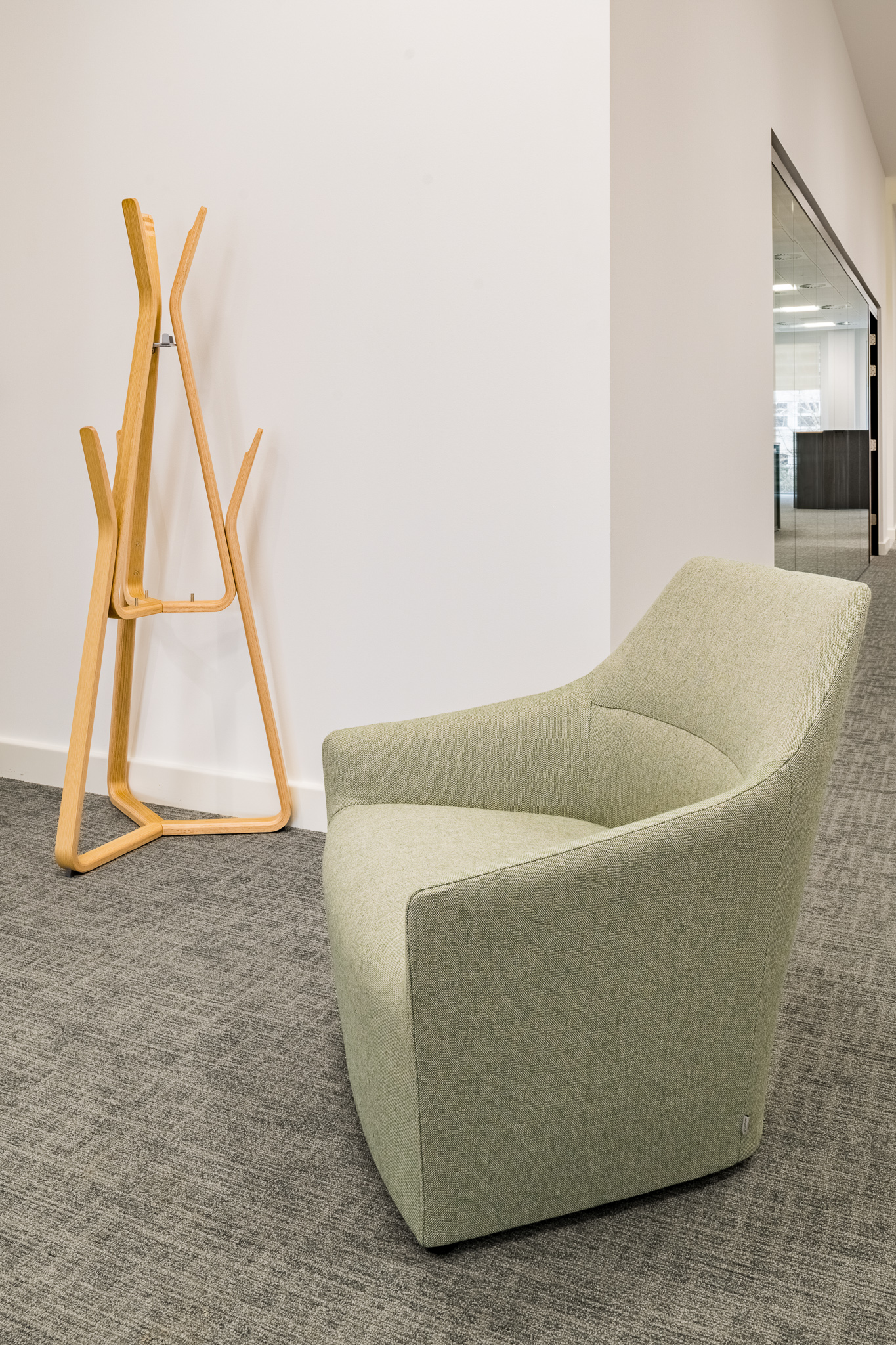 Theo Coat Stand in natural oak in an office